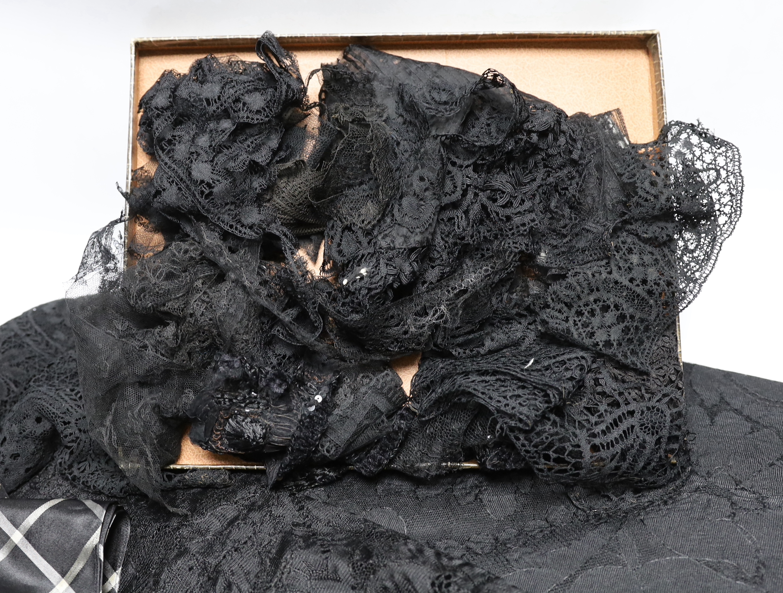 A collection of mostly 19th century French and English needle and bobbin lace trimmings, white worked sleeves, a black silk stole and black lace trimmings etc